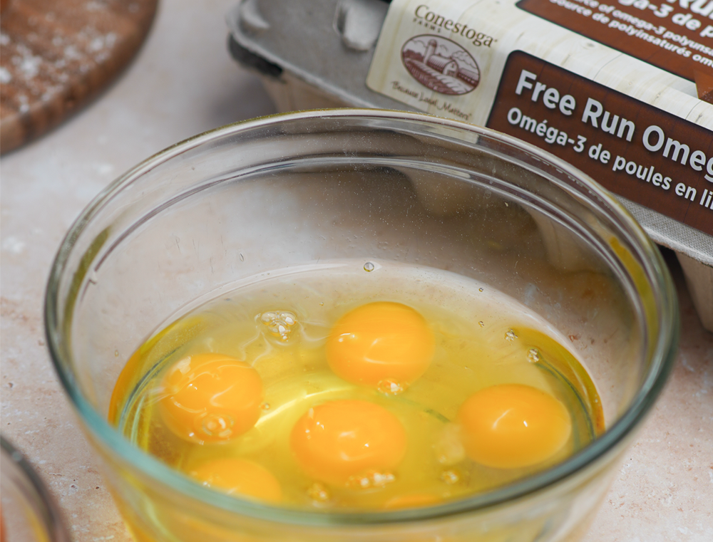 close up bowl of golden egg yolks